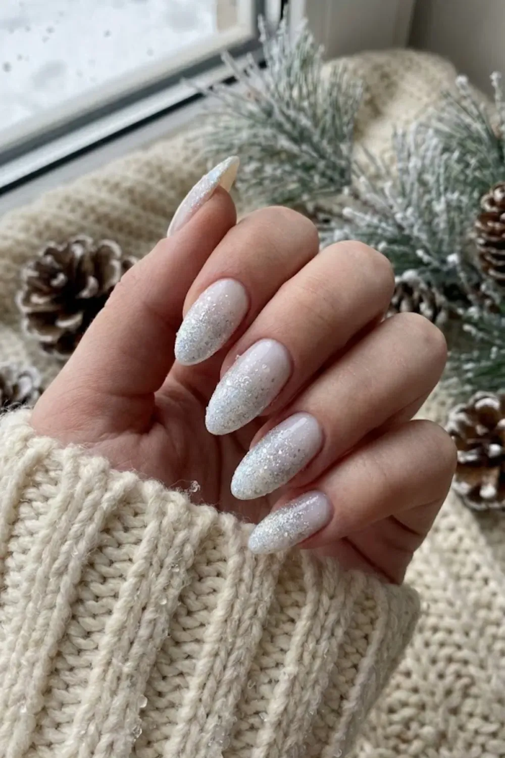 Milky White Nails with Silver Glitter Ombre - Soft milky white almond nails with a subtle silver glitter fade at the tips.