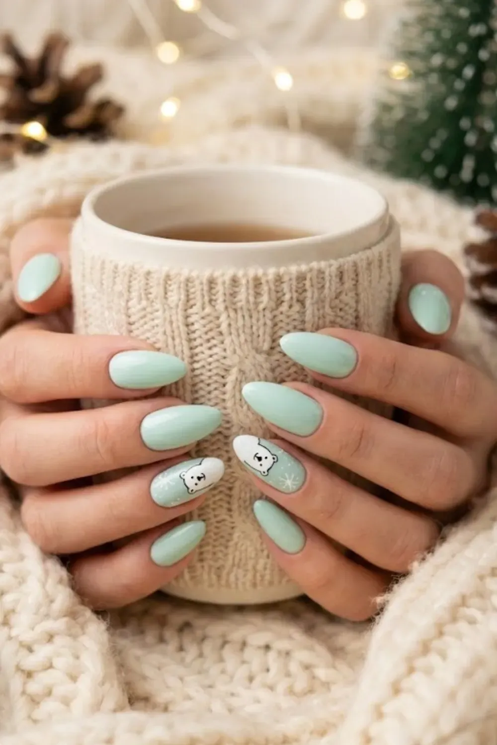 Mint Polar Bear Nails – pastel mint almond nails with cute hand-painted polar bear winter art