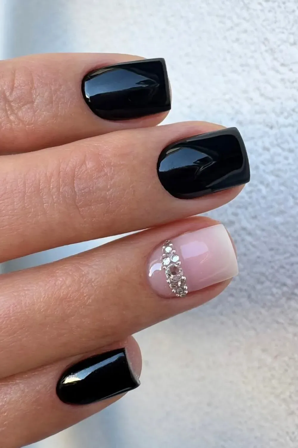 Black with Rhinestone Accent	Glossy black nails with nude rhinestone cuff accent nail
