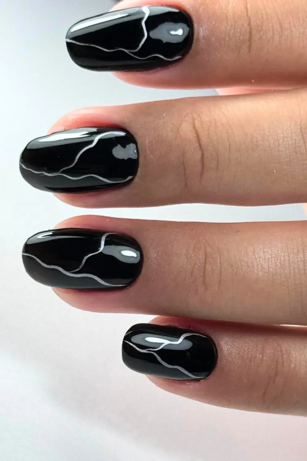 Minimalist Abstract White Lines	Oval black nails with thin white wavy abstract lines