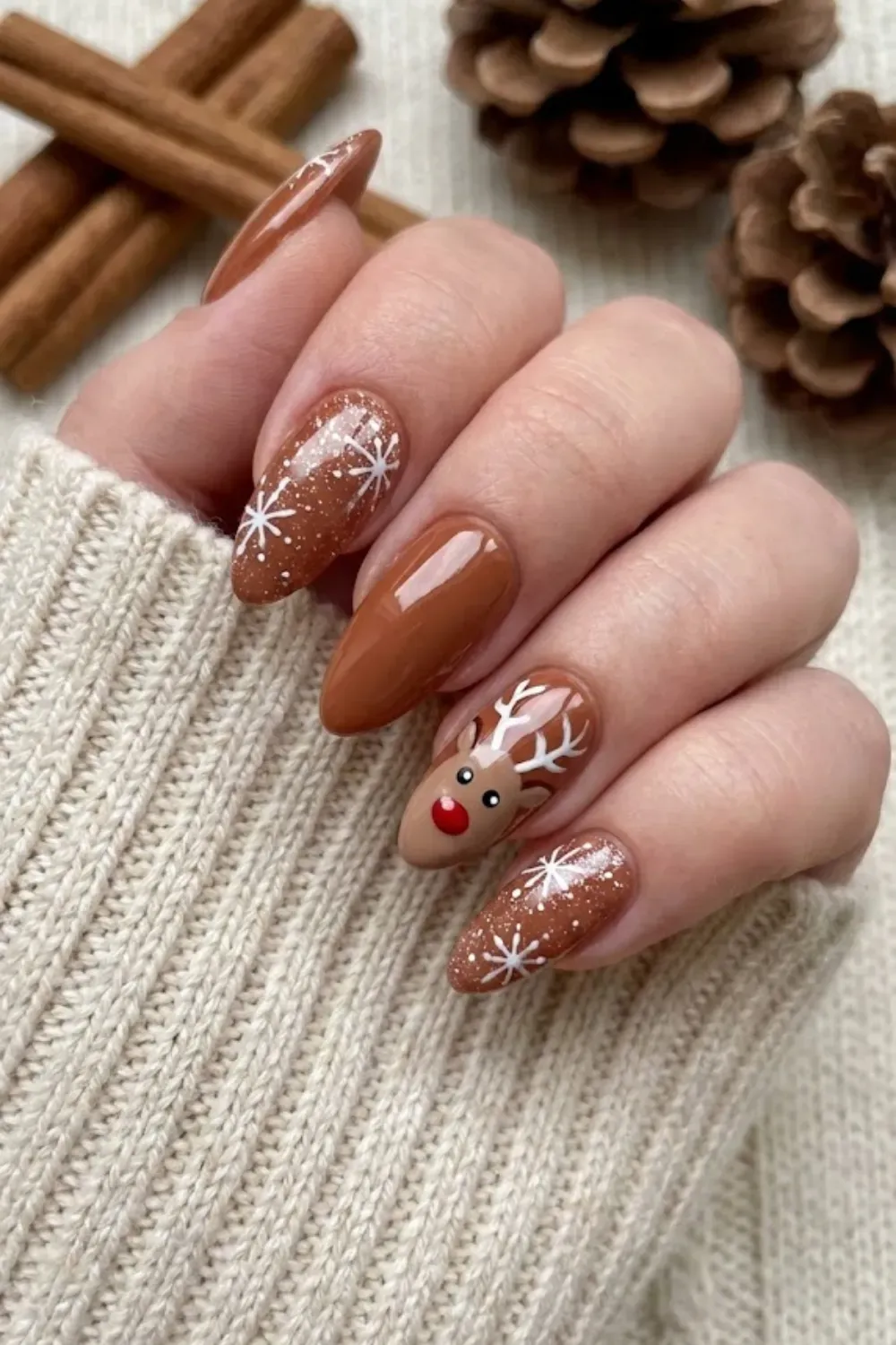 Cute Gingerbread and Reindeer Nail Art - Brown almond nails featuring hand-painted gingerbread man and reindeer character art.