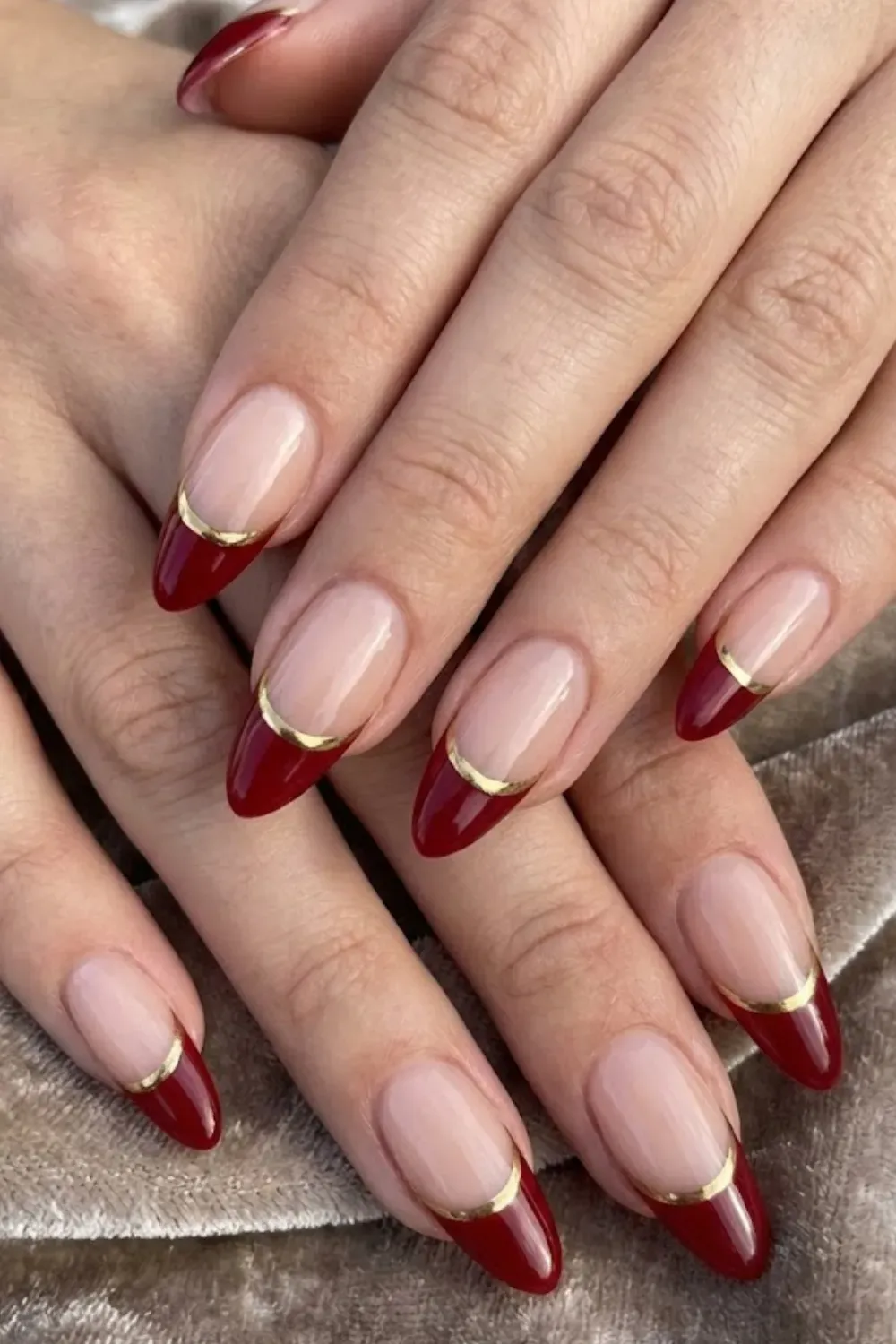 Red Chrome Double French — almond nails featuring red chrome tips with a secondary thin gold chrome line.