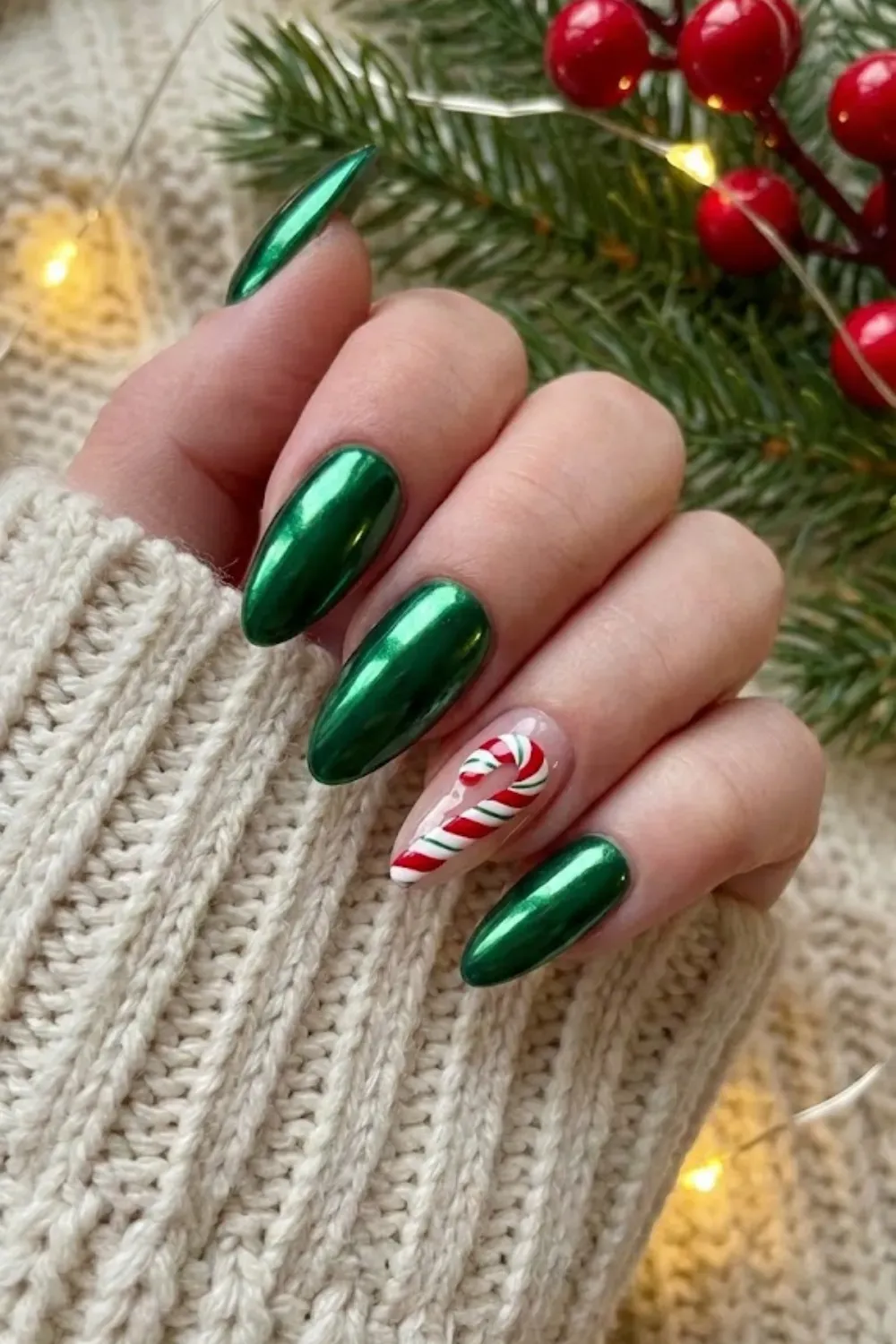 Green Chrome Nails with Candy Cane Accent - Trendy green chrome manicure paired with a nude accent nail featuring a realistic candy cane.