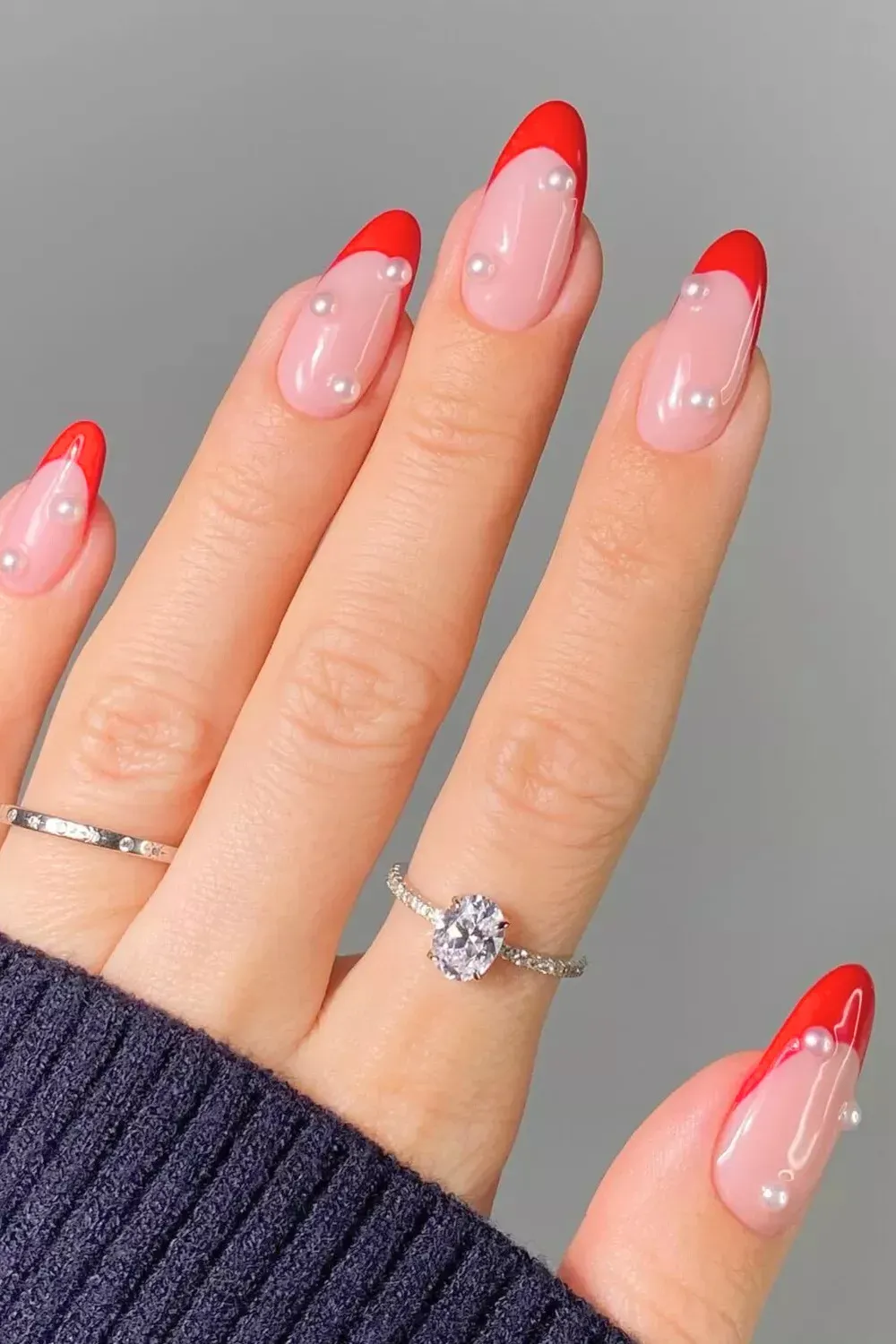 Red French Nails with Pearl Accents - Classic red french manicure embellished with small white pearls.