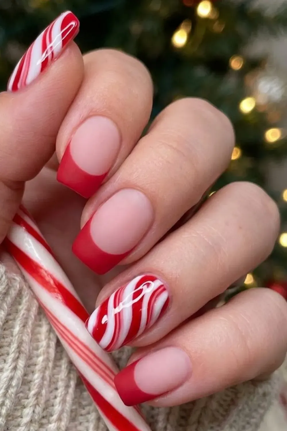 Candy Cane Swirl Nails — square nails alternating between matte red tips and red and white candy cane swirls.