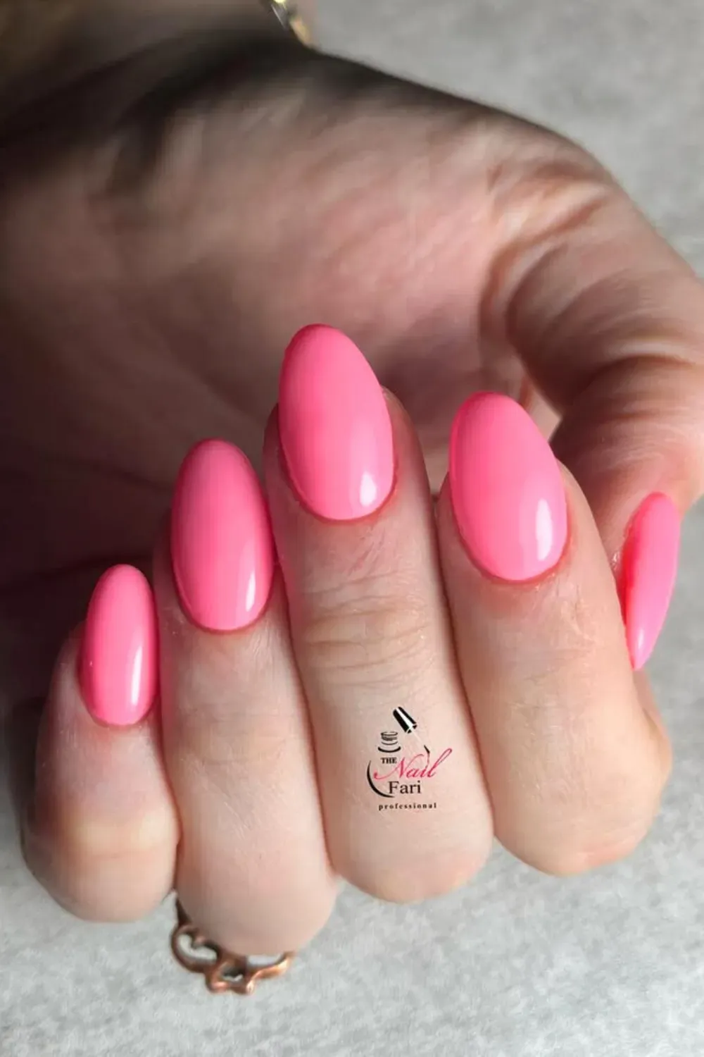 Vibrant Bubblegum Pop - Simple and glossy bright neon pink oval nails for a pop of color.