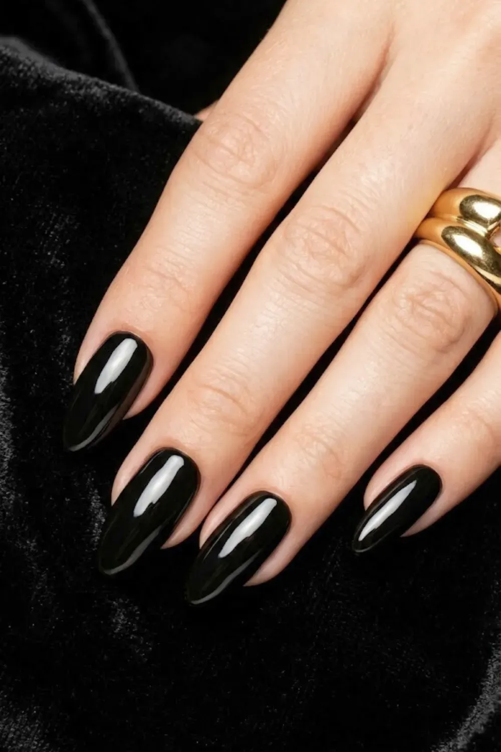 High-Gloss Jet Black – Pure black gel nails almond shape editorial look