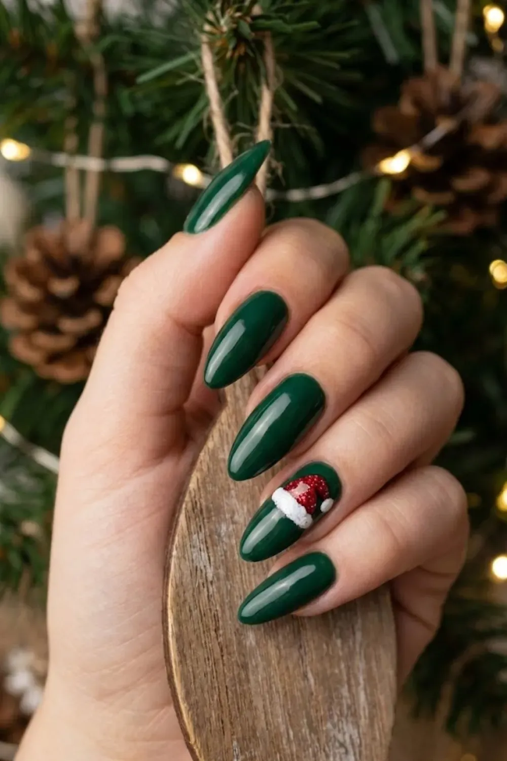 Santa Hat Accent Nails – deep green glossy nails with textured glitter Santa hat accent