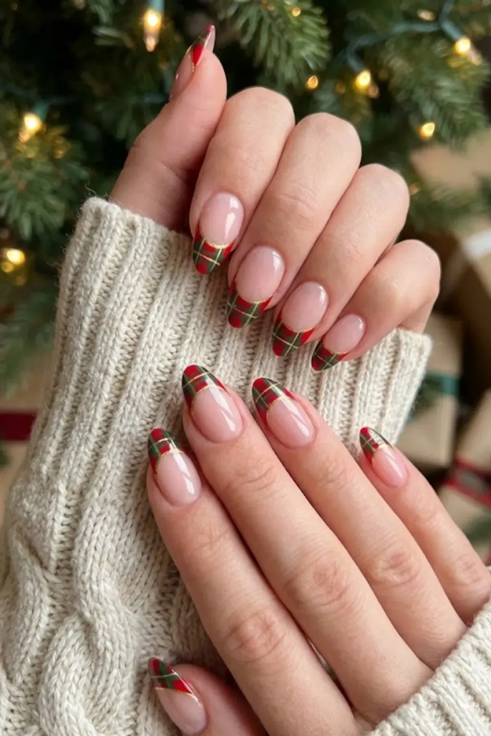 Tartan Plaid French Nails — oval nails featuring red and green plaid patterned French tips with gold outlines.