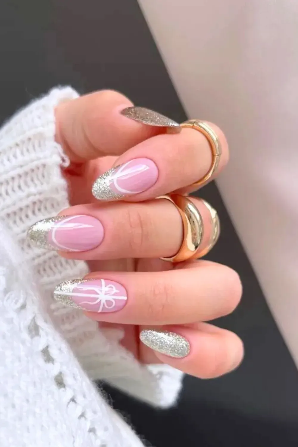 Silver French & Gift Bow - Oval pink nails with silver glitter french tips and a white ribbon bow drawing