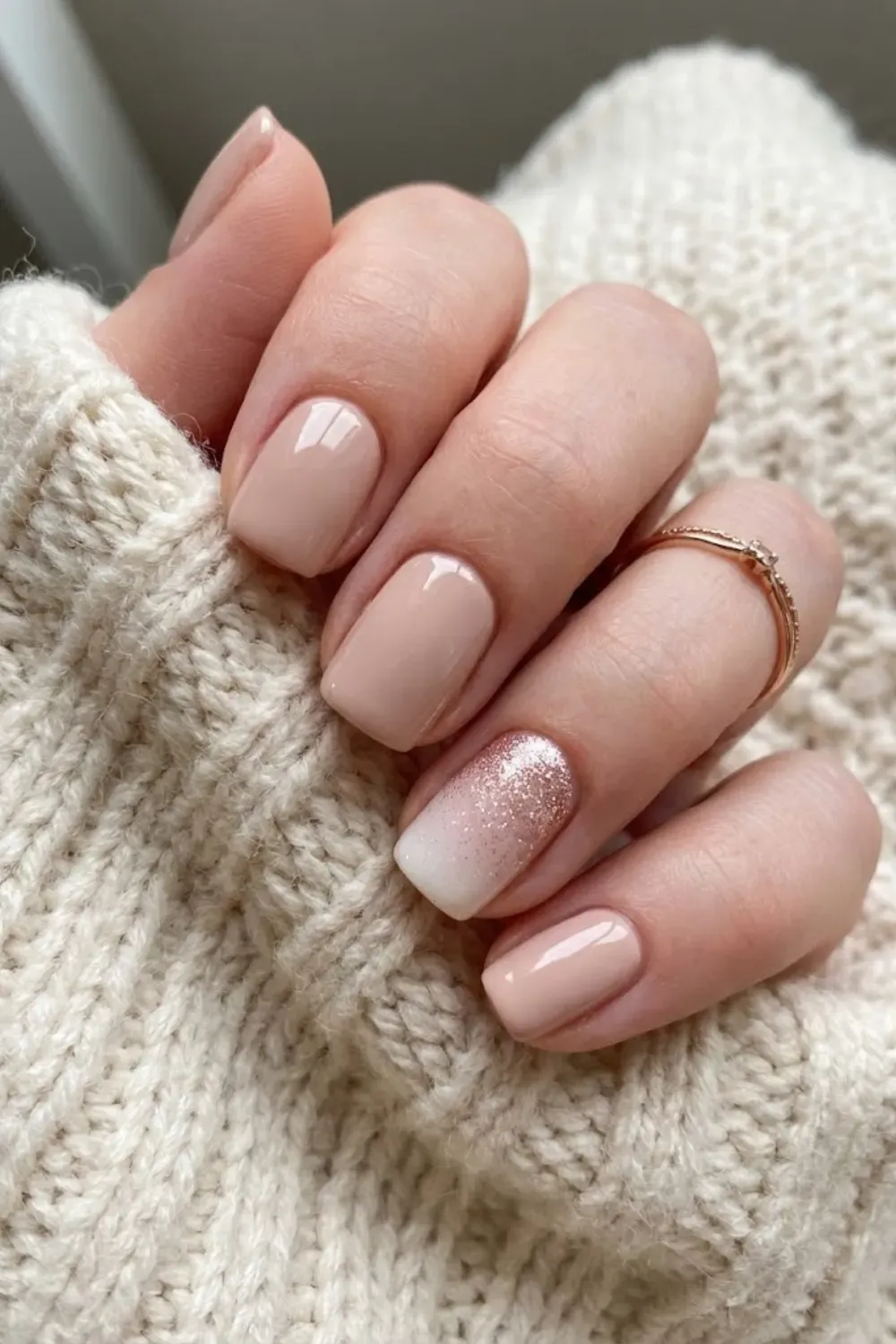 Blush Beige with Glitter Ombré Accent - Short squoval blush nails featuring one accent nail with a soft milky white and rose gold glitter ombré fade.