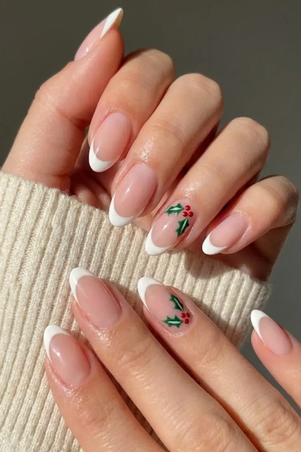 Minimalist Holly French Nails — white French tips on oval nails with delicate holly berry nail art.