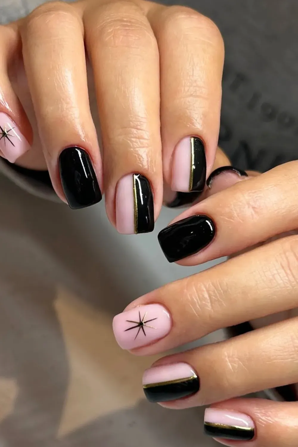 Modern Pink and Black Block	Square pink and black geometric nails with gold strip
