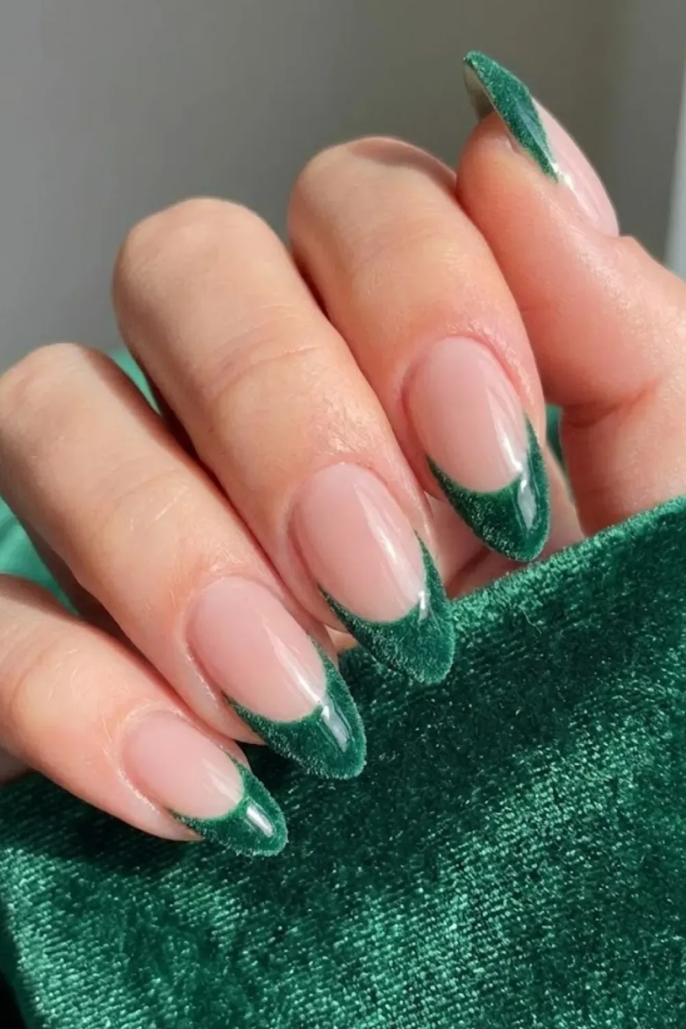Green Velvet Cat-Eye Nails — oval nails featuring emerald green velvet cat-eye magnetic French tips.