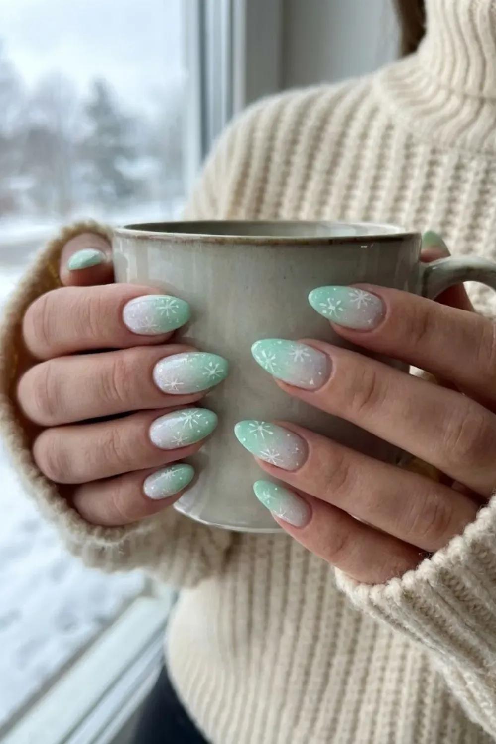 Ombre Snowflake Nails – gradient green to white almond nails with delicate white snowflakes