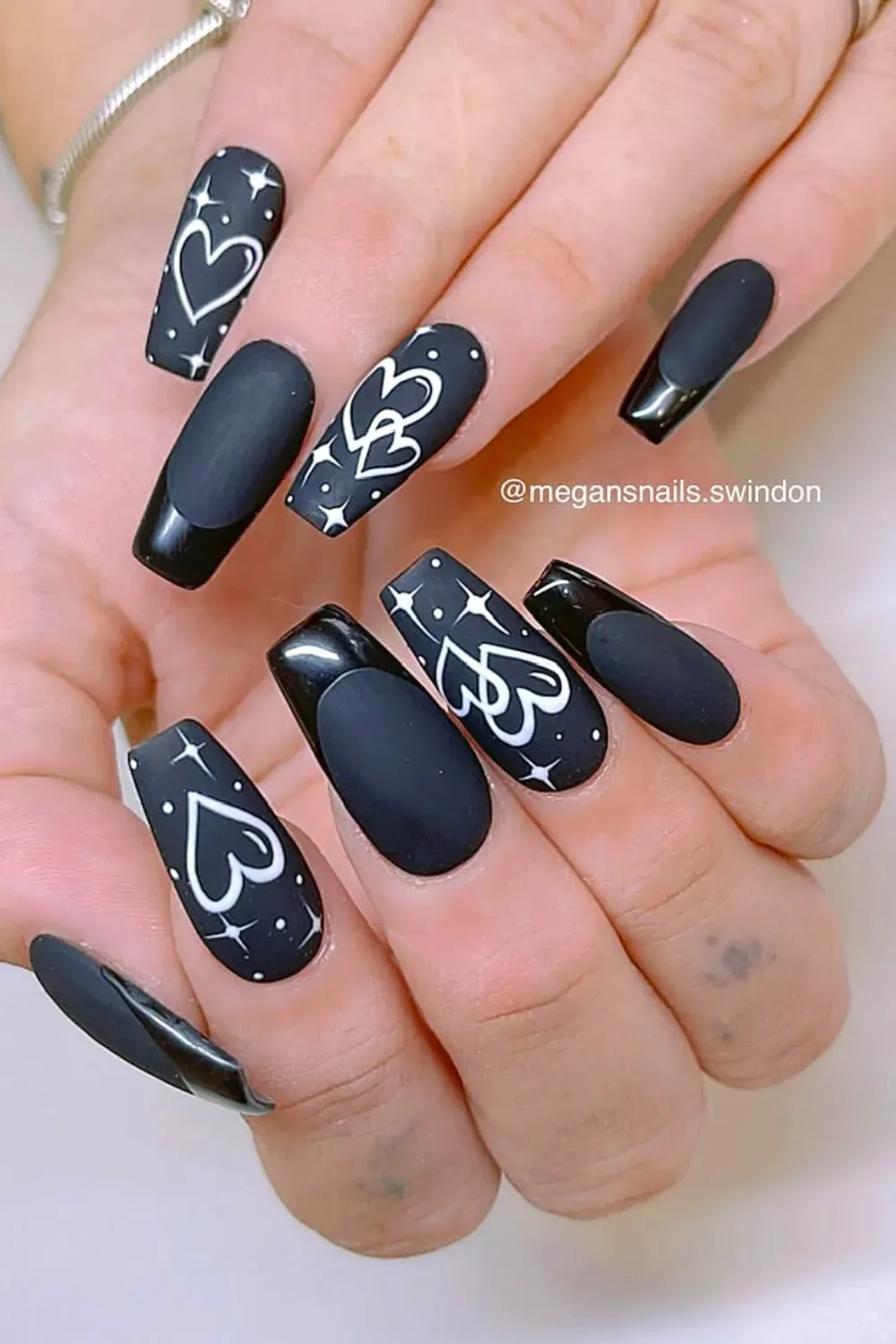 Celestial Matte French Coffin	Matte nude nails with black french tips and white hearts