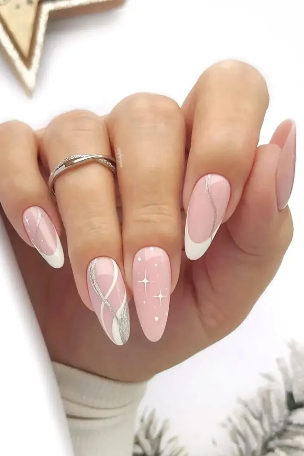 Celestial Swirls & Stars - Almond pink nails with white french outline, silver swirls, and star accents