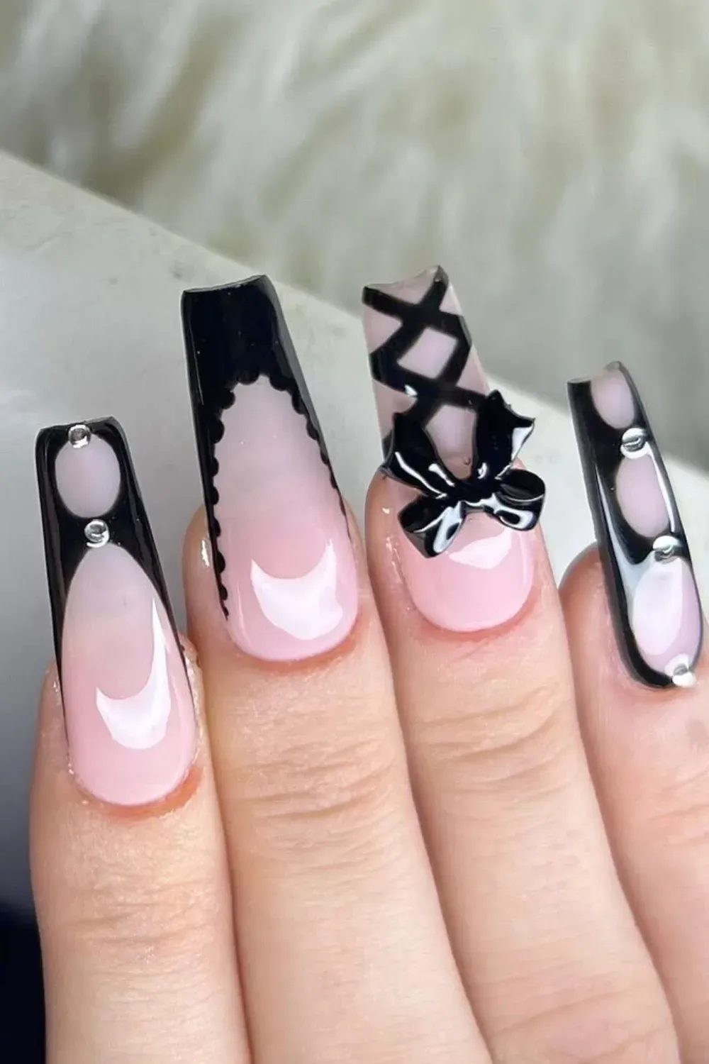 Intricate Lace and Bow French	Coffin nails with black lace french tips and ribbons