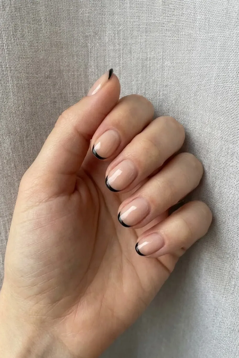 Ultra-Thin Black Micro French - Short natural base nails featuring a very thin, modern black French tip line for an edgy minimalist look.