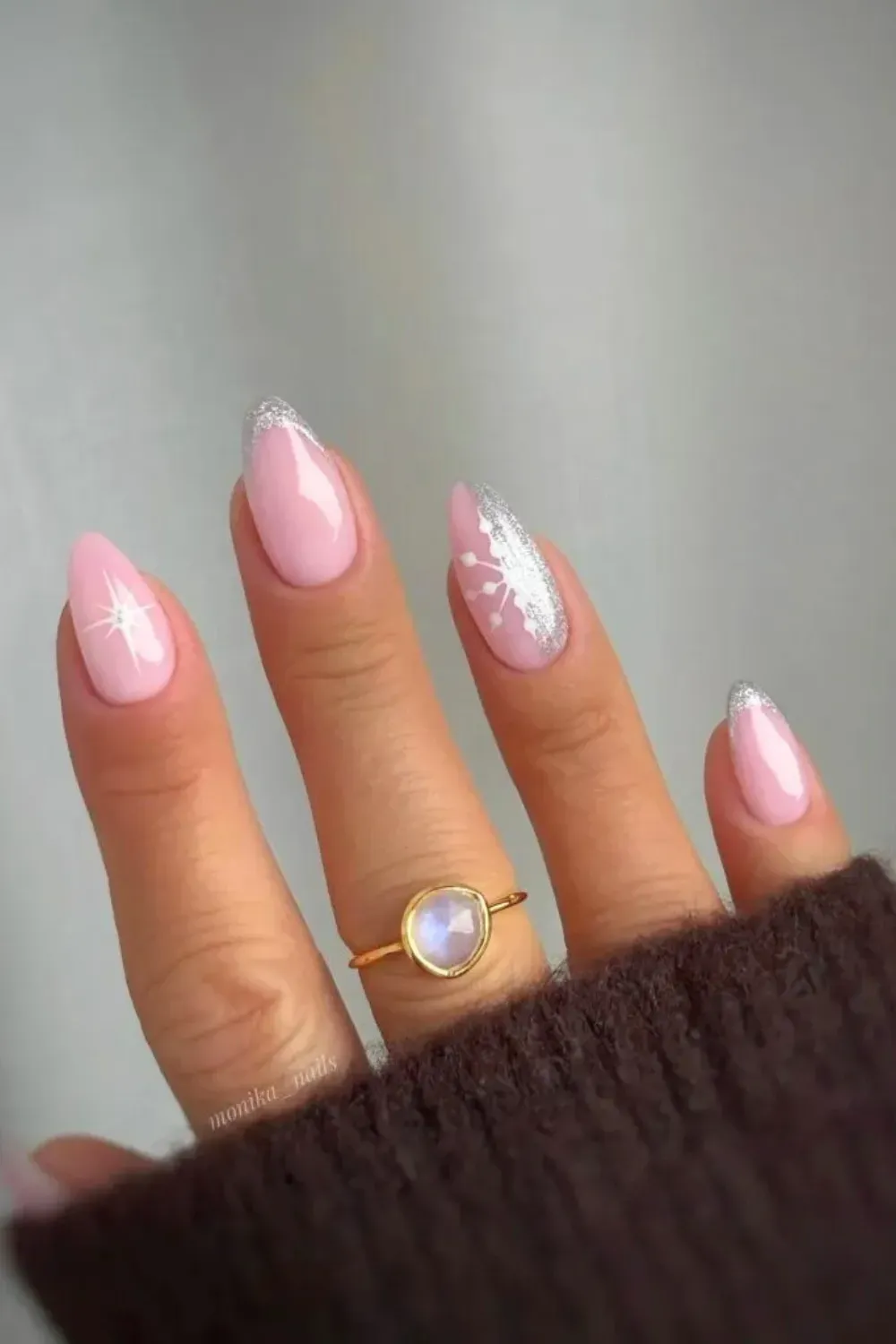 Classic Sparkle Snowflake - Almond blush pink nails with a silver glitter french tip and snowflake accent.