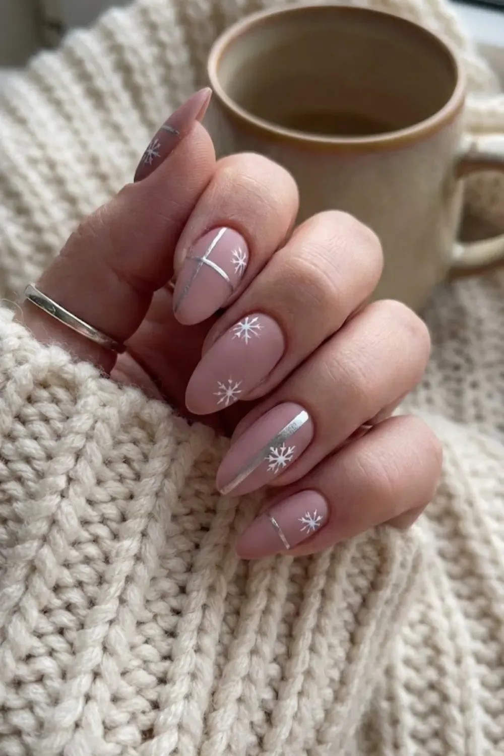Matte Mauve Nails with Silver Snowflakes - Matte dusty pink nails with modern silver geometric lines and white snowflake art.