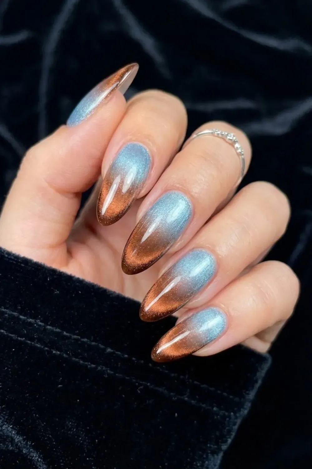 Fire and ice ombre cat eye nails blending icy blue and copper brown