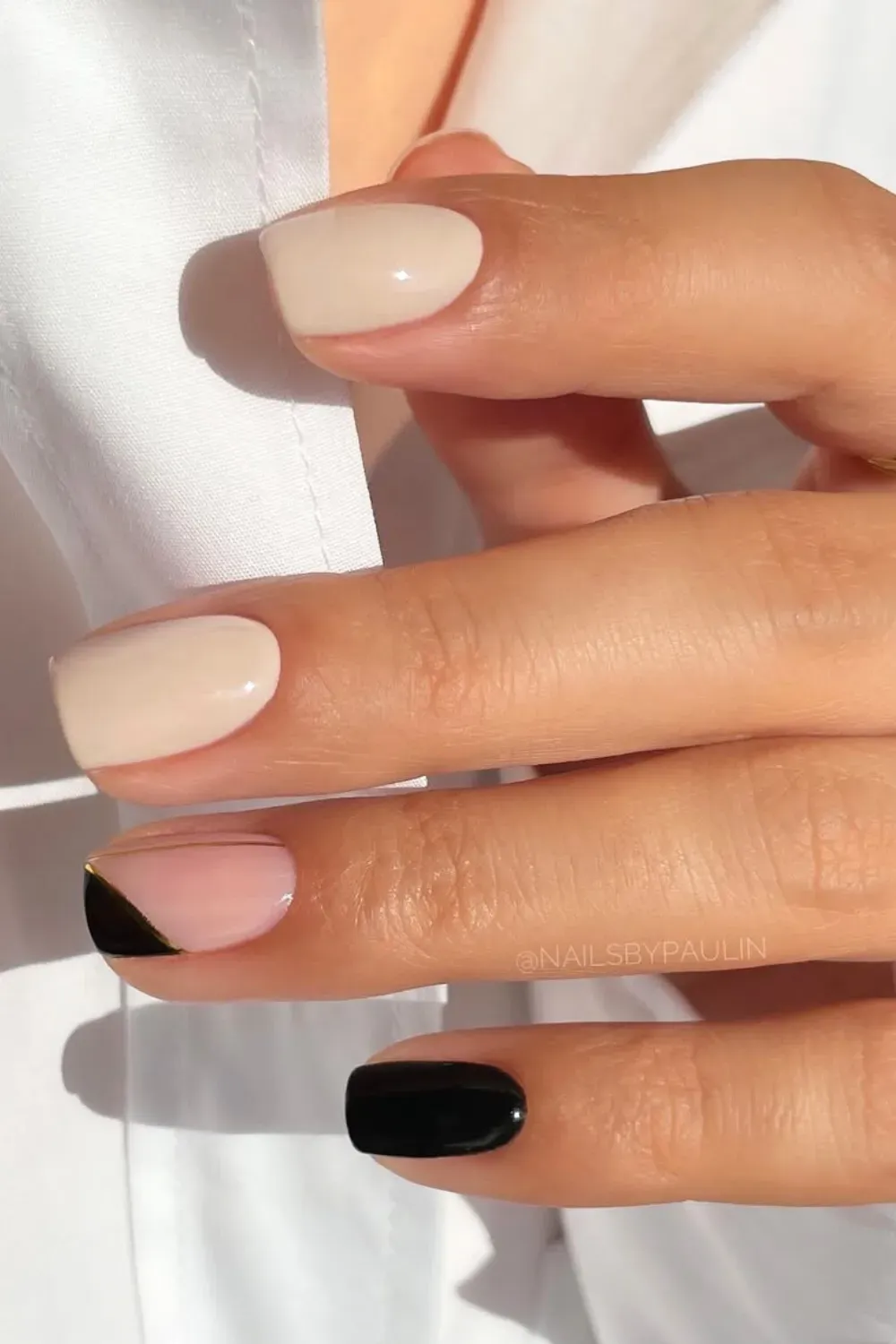 Geometric Gold Line	Nude nails with black geometric corner and gold line