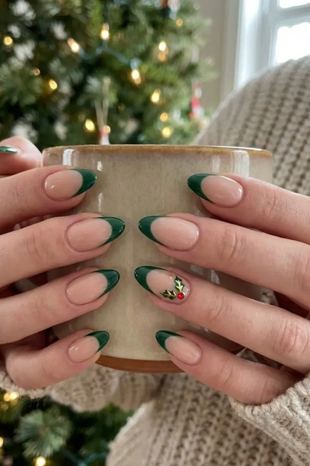 Hunter Green Holly Nails — oval nails with dark green French tips and subtle holly berry accents.