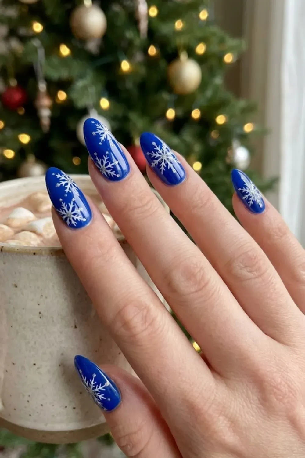 Royal Blue Elegant Snowflakes - long almond royal blue nails with large detailed white snowflake art