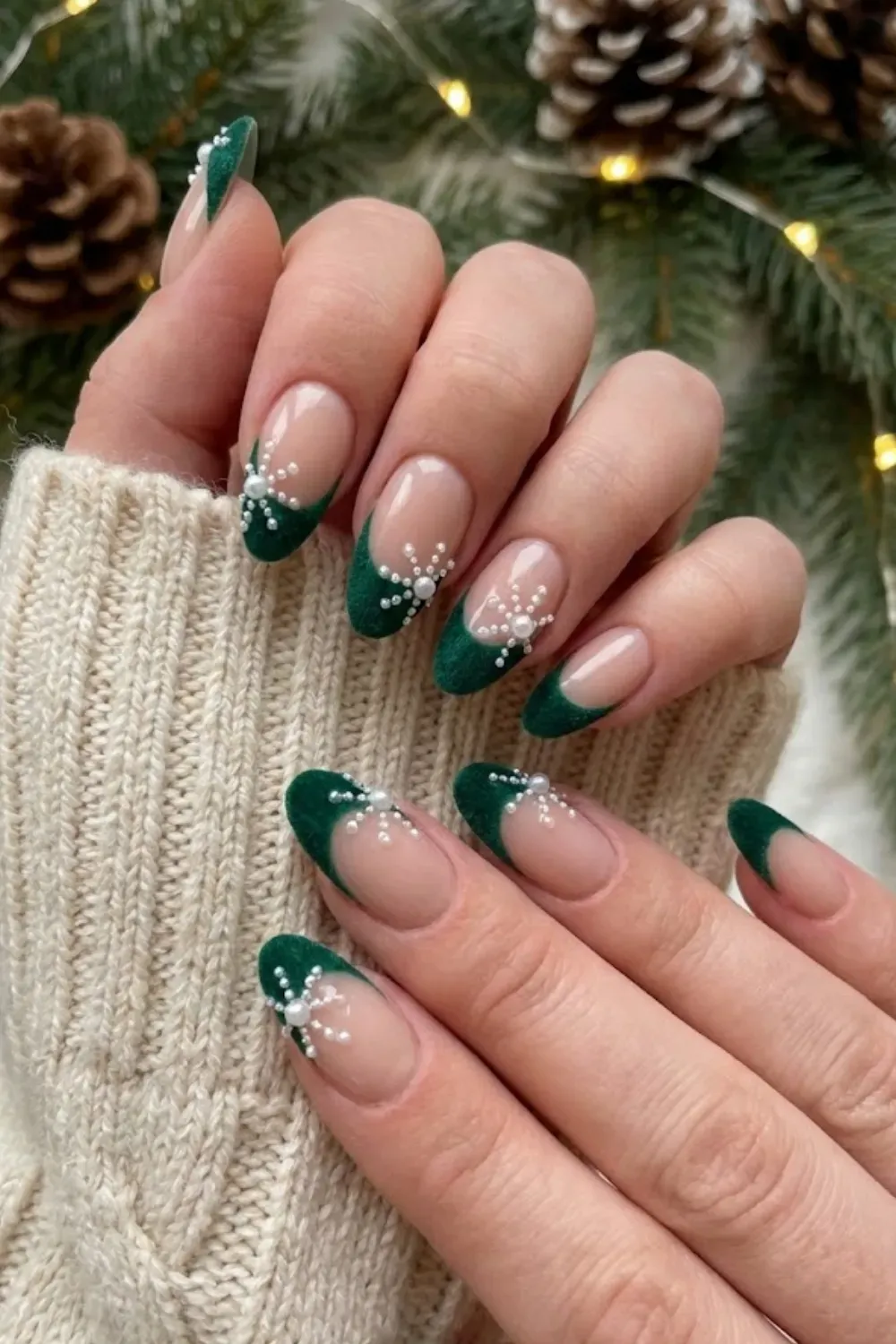 Green Velvet Pearl Snowflakes — almond nails with green velvet tips and snowflakes made of tiny pearls.