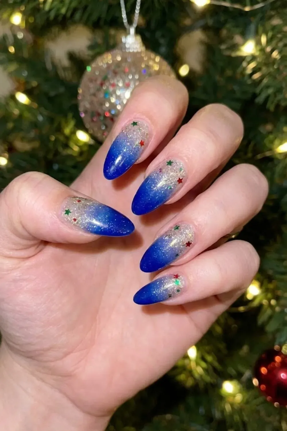 Midnight Blue to Silver Glitter Ombré - long almond ombre nails fading from dark blue to silver glitter tips