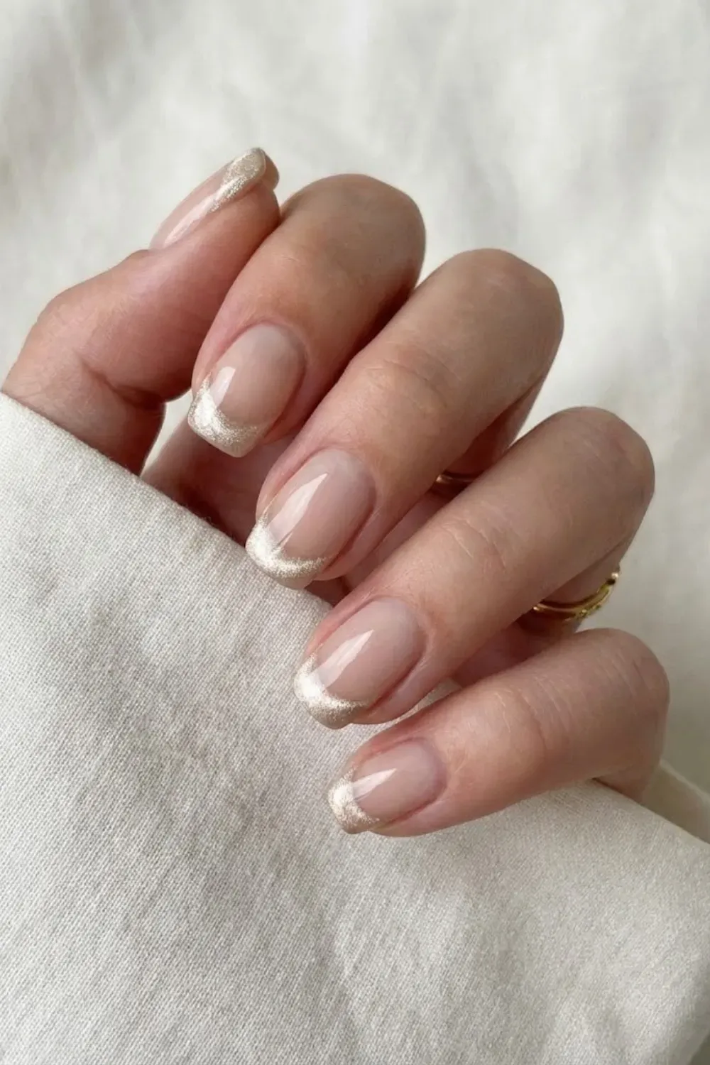 Modern chrome french tip nails with champagne cat eye finish