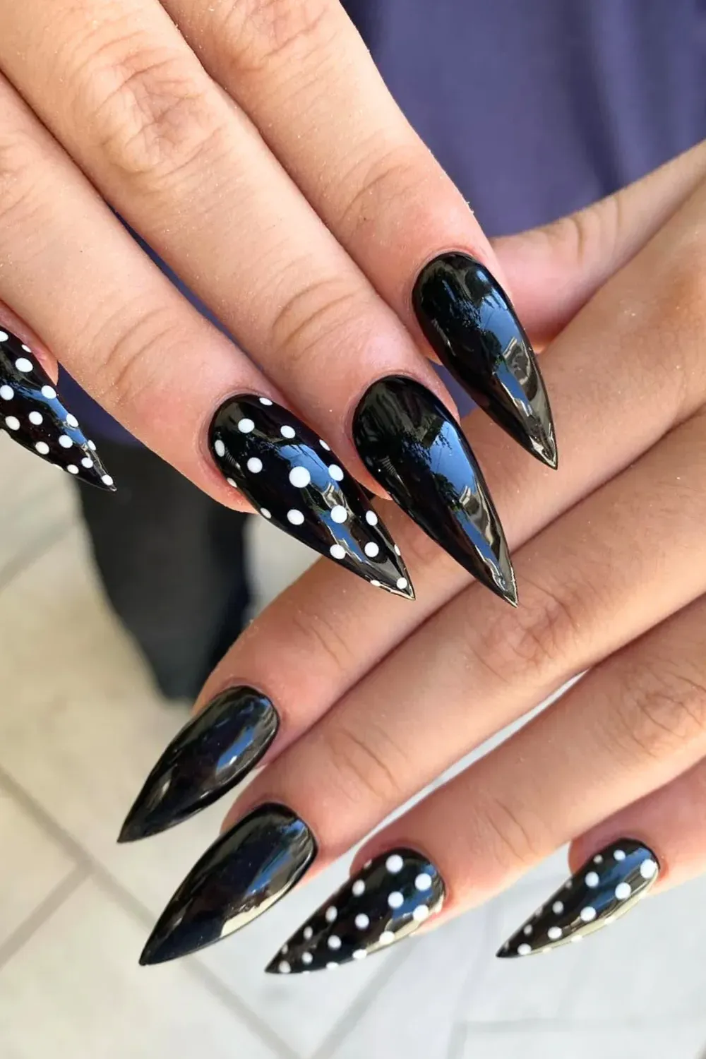 Retro Black Polka Dot Stilettos	Black stiletto nails with white polka dots