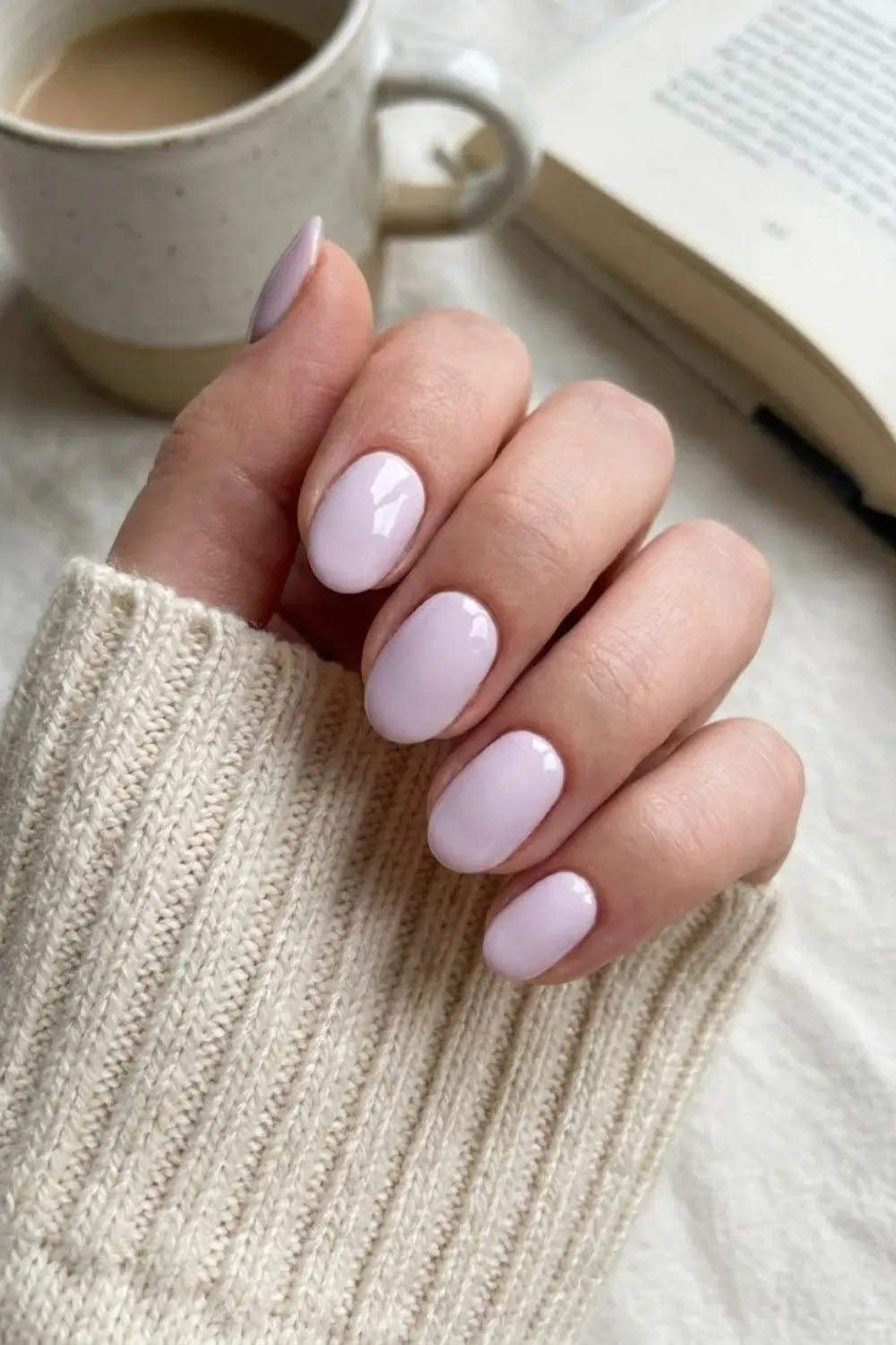 Soft Lilac Cream Oval - Short oval nails with a delicate, glossy pastel lilac cream manicure, perfect for a soft pop of color.