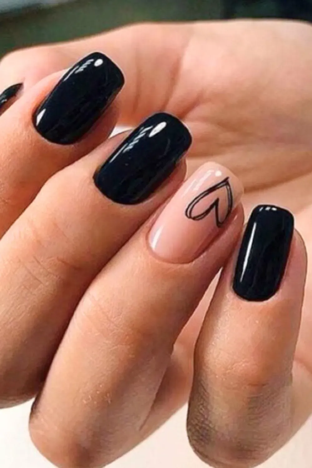 Cute Heart Outline Accent	Black nails with nude accent nail and black heart outline