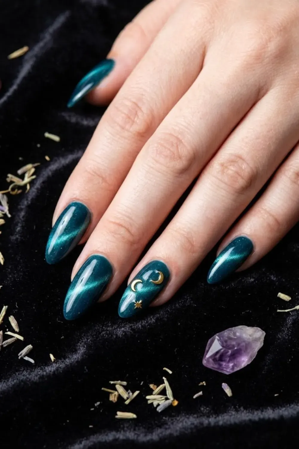 Teal cat eye nails with gold moon and star celestial charms