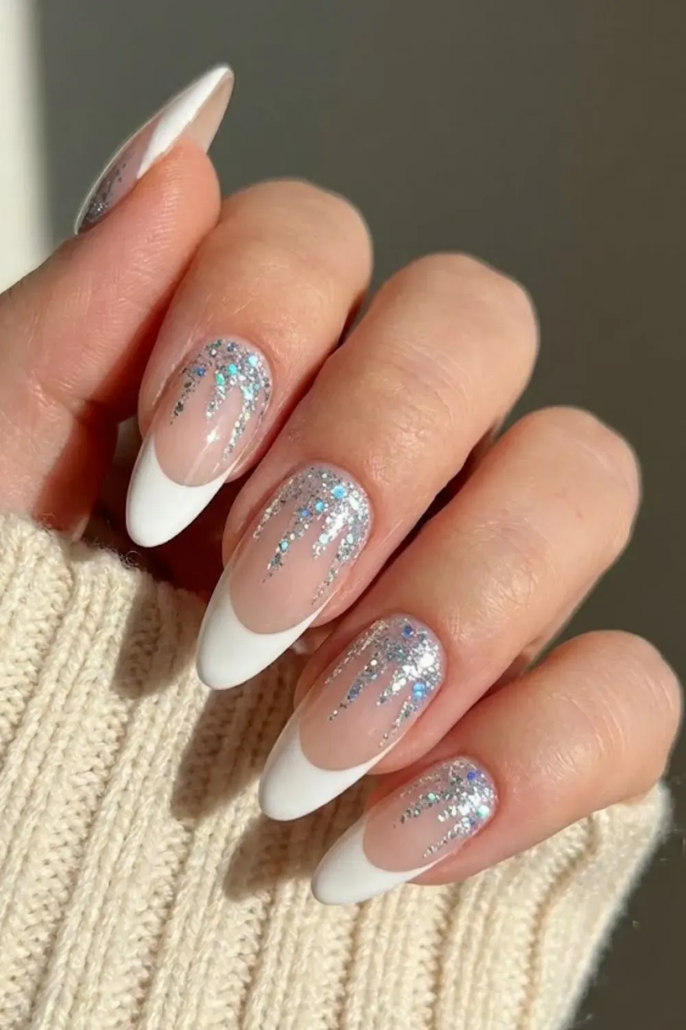 Silver Glitter Drip Nails — almond nails with white tips and cascading holographic silver glitter drips.