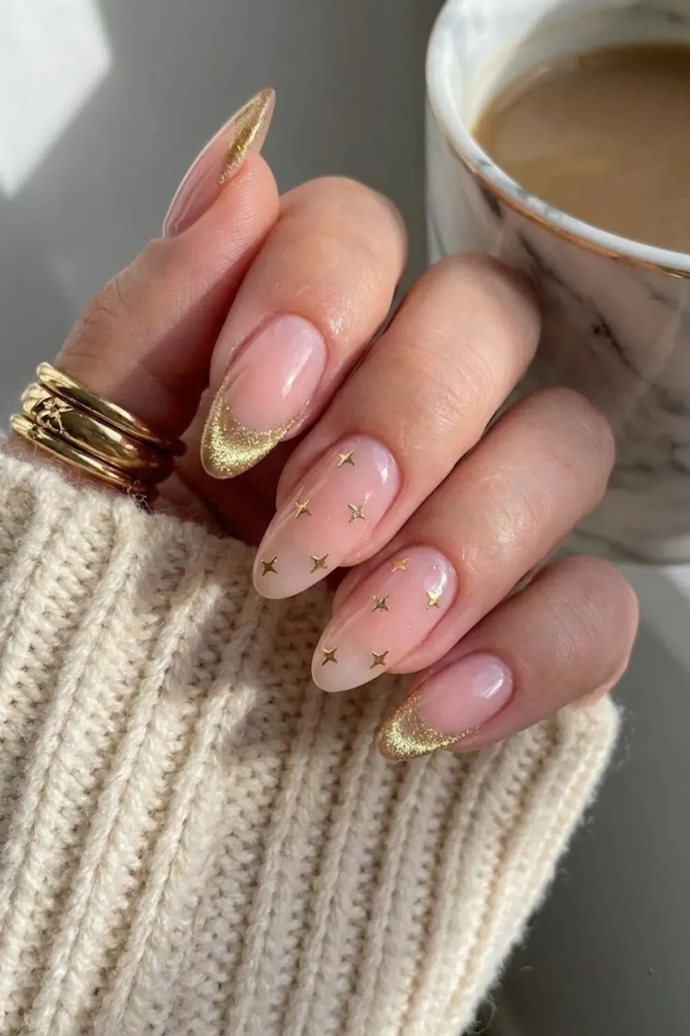 Mix and match cat eye nails with french tips and star accents