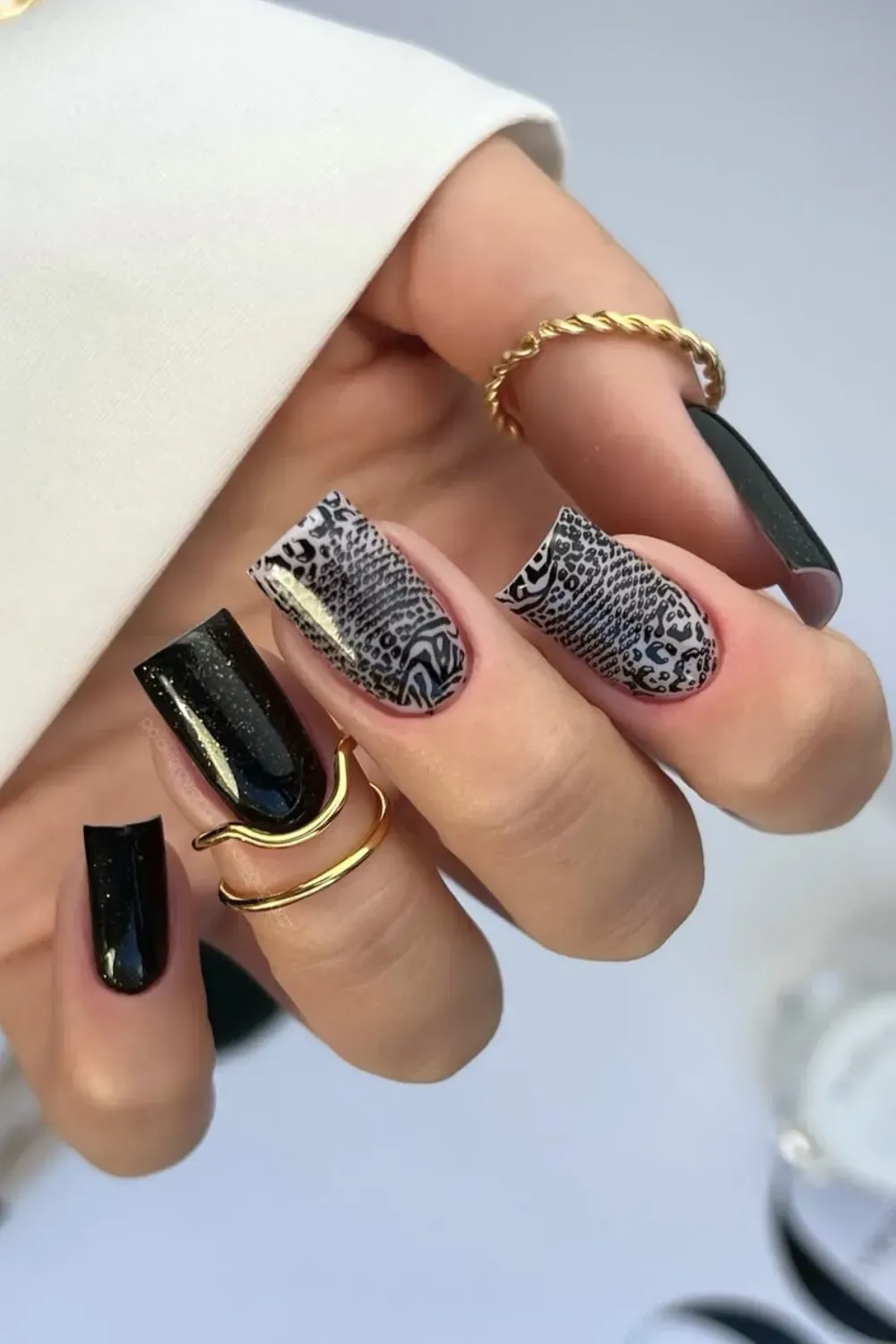 Wild Animal Print Mix	Long nails with black and grey animal print and glitter
