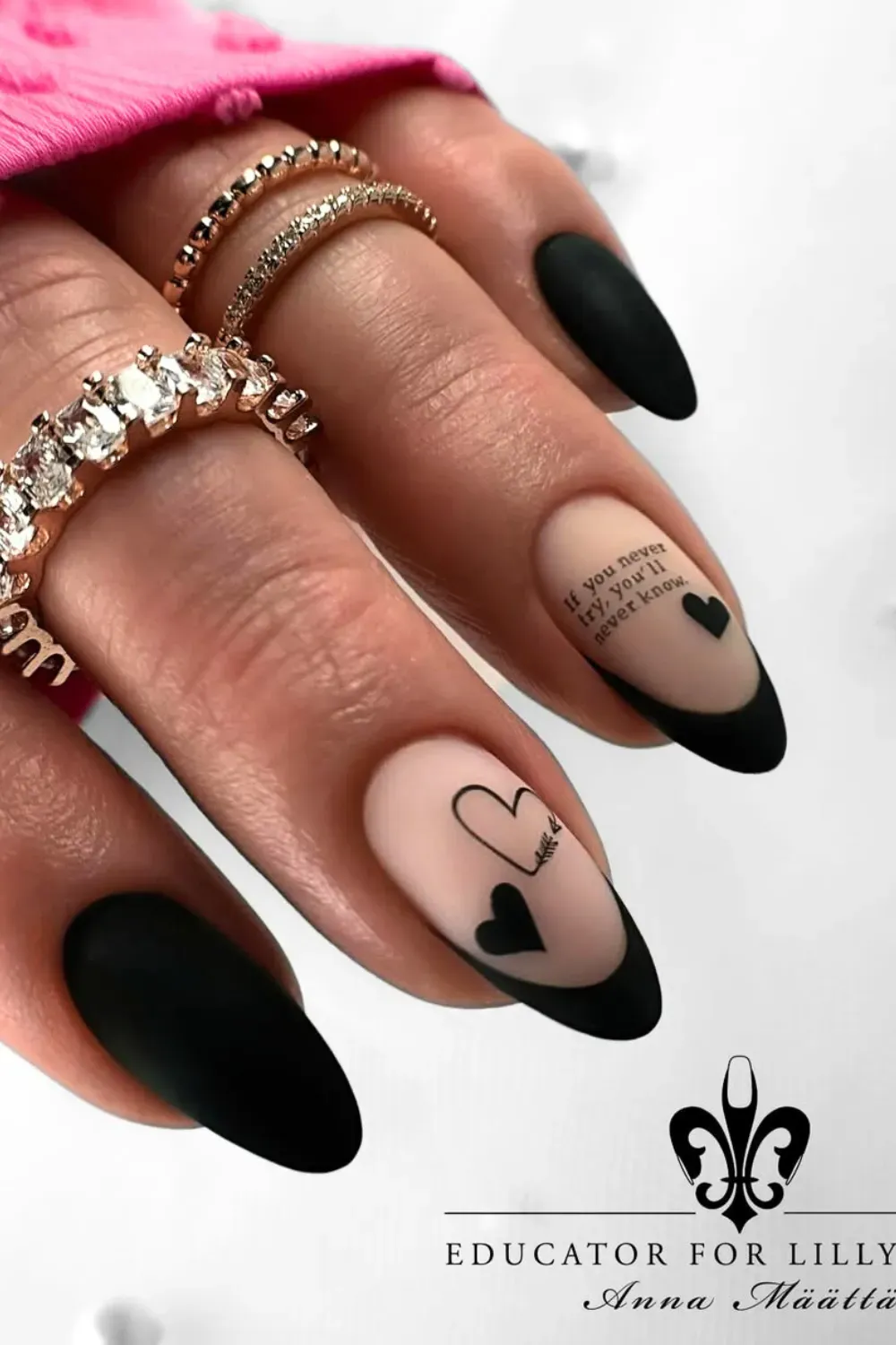 Romantic Script and Hearts	Matte nude nails with black hearts and script writing