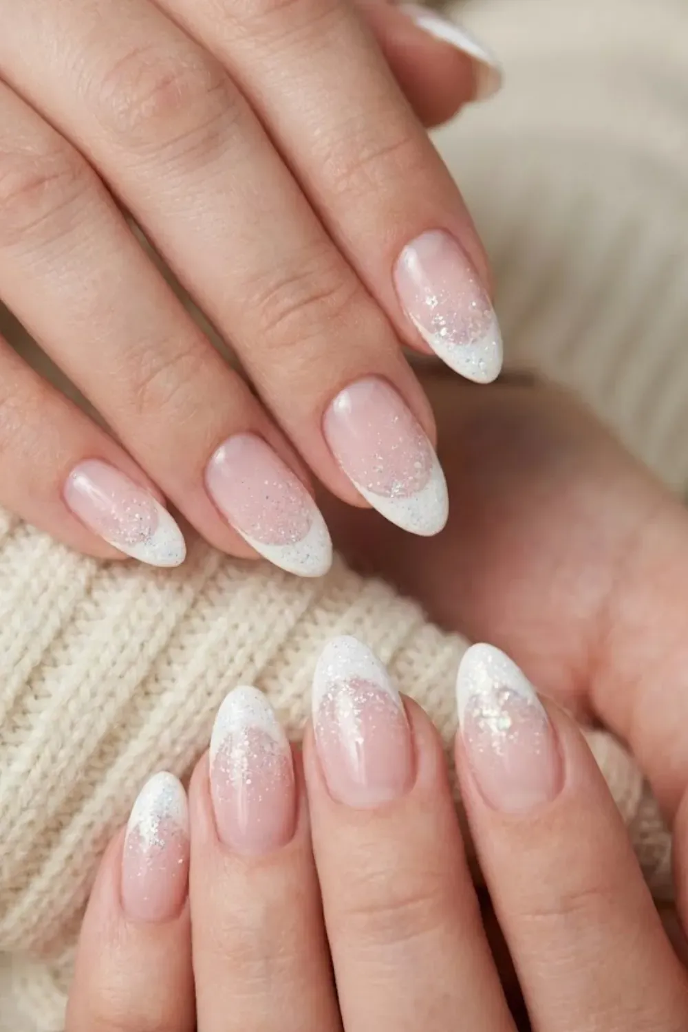 Frosted White Ombre Stiletto — stiletto nails with a sharp white tip fading into frosted white glitter.