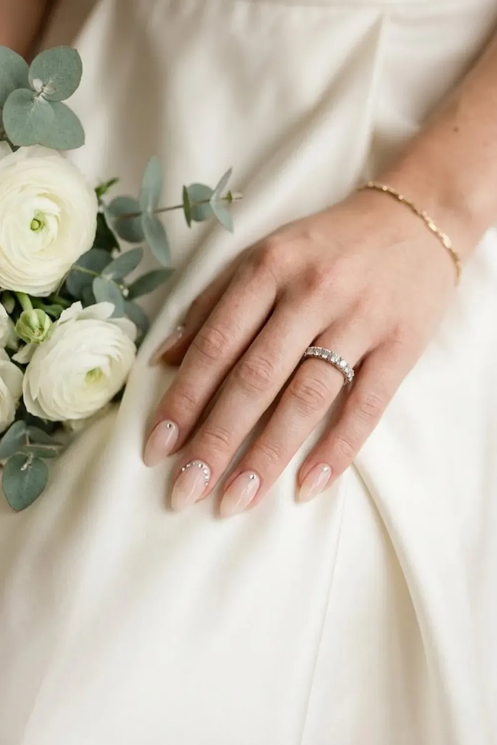 Elegant Crystal Cuticle Crescent - Hand on dress; crystals lining the bottom curve (cuticle) of nail.