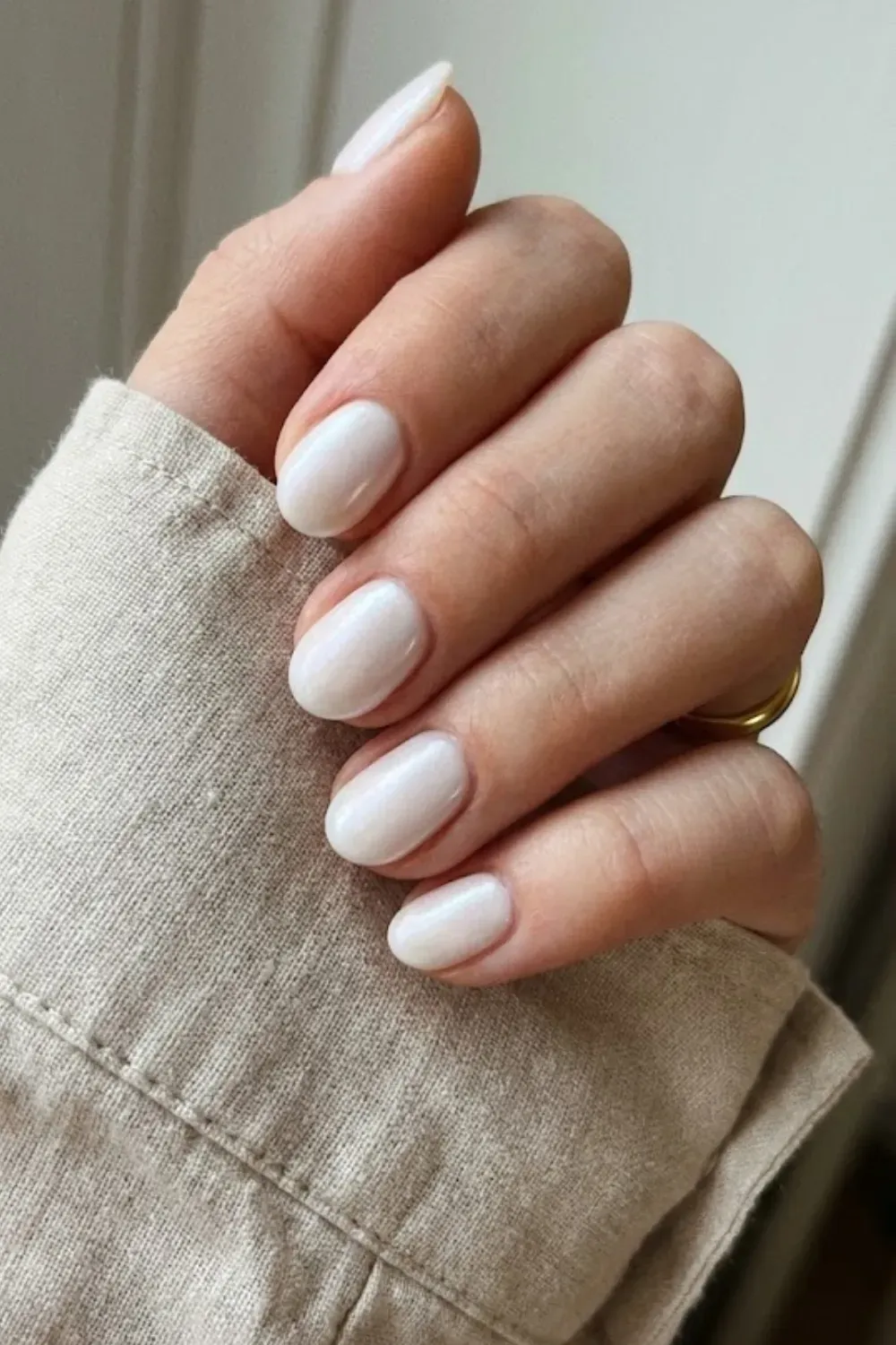Glazed Milky White – Short oval nails with a pearlescent glazed donut finish in soft white