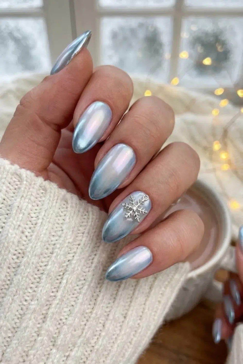 Icy Blue Chrome Snowflake Charm - almond pearlescent light blue chrome nails with silver snowflake charm
