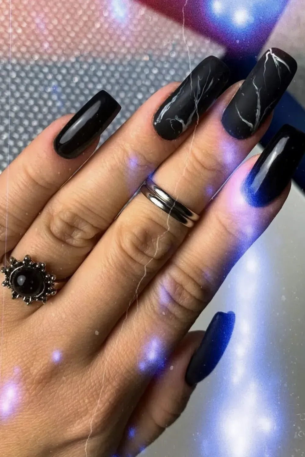 Elegant Marble and Blue Accent	Matte marble nails with one bright blue accent nail