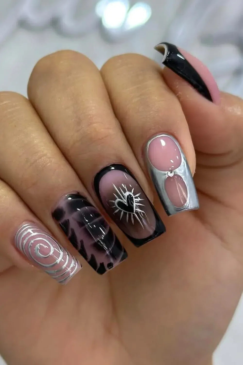 Modern Eclectic Mix	Square nails with silver swirls, hearts and mixed art