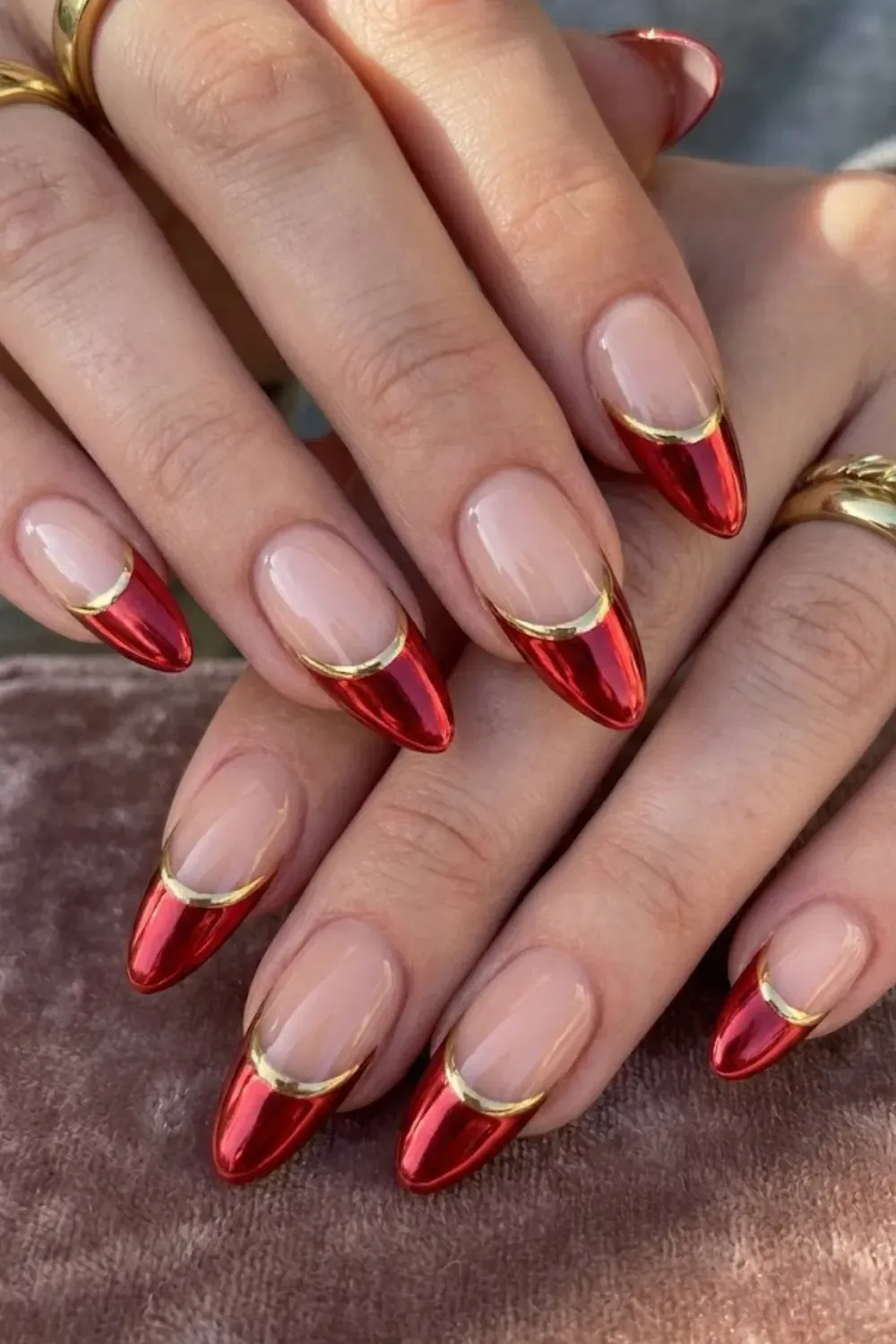 Red Chrome Gold Outline Nails — almond nails with red chrome tips sharply outlined with a gold line.