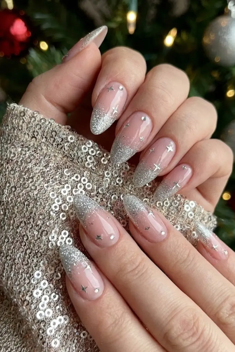 Silver Glitter Star Nails — long almond nails with a silver glitter gradient tip and holographic stars.