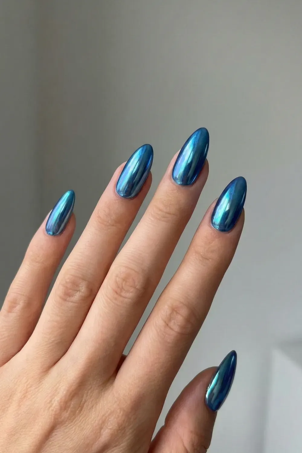 Sleek Sapphire Blue Chrome - long almond ultra shiny metallic sapphire blue chrome manicure