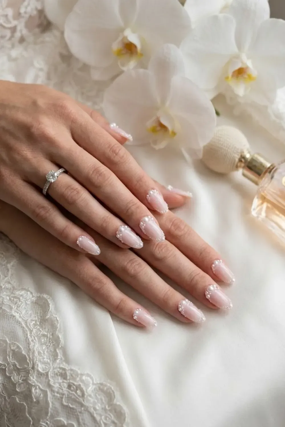 Luxury Pearl Border Outline - Long almond nails; tiny pearls glued all around the edge.